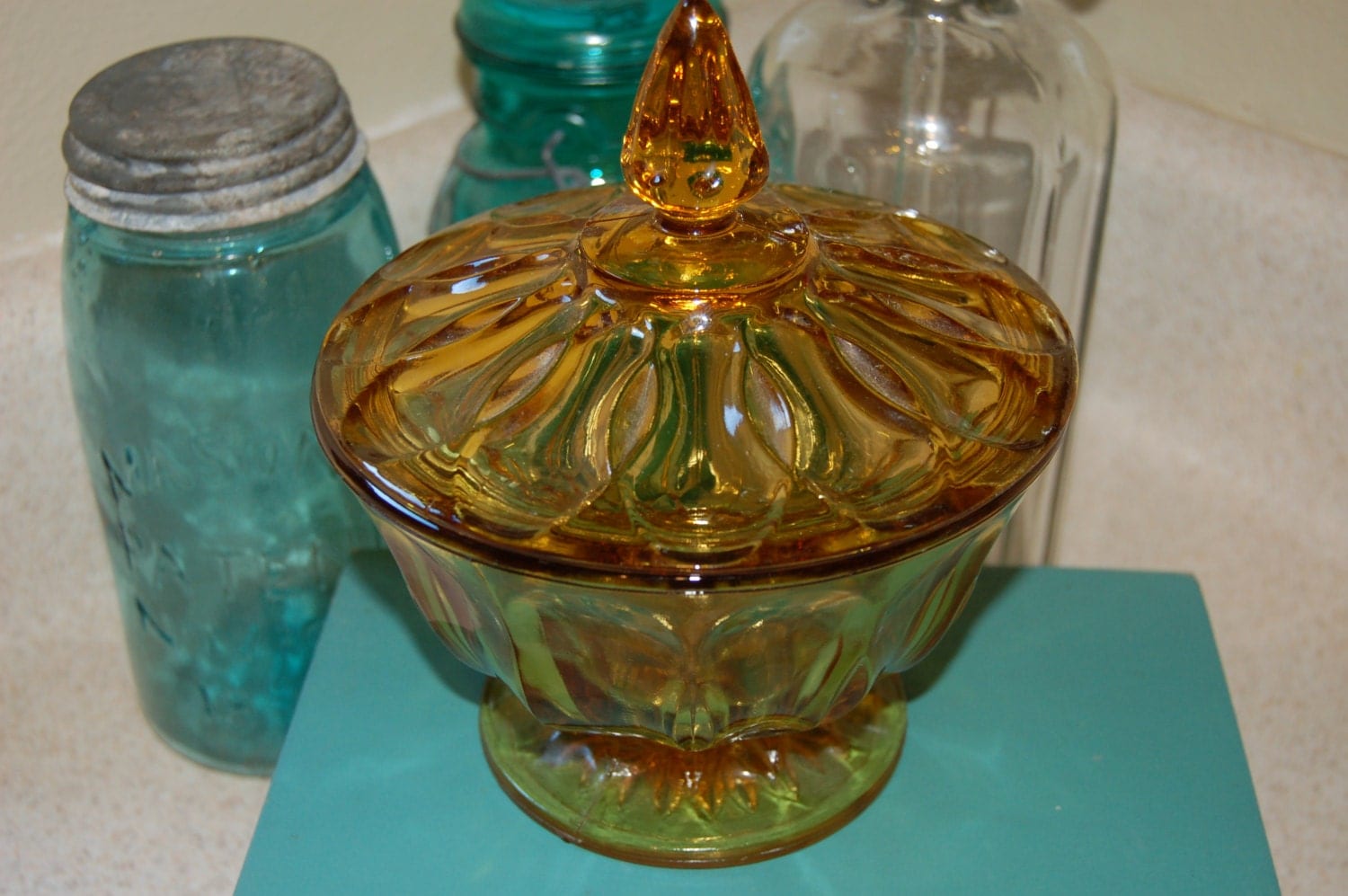 Vintage compote amber glass candy dish with lid.