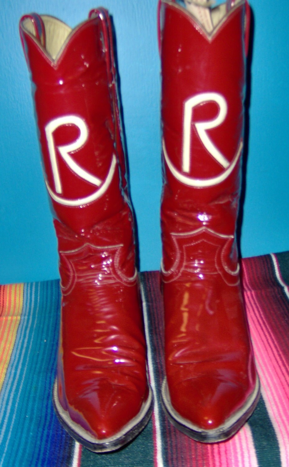 Red Champion custom cowboy boots with inlayed rocking R