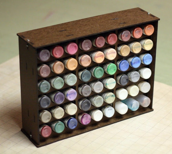 Paint rack holds 54 dropper style paint bottles.