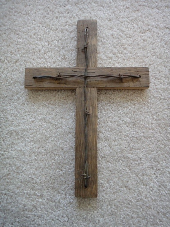 Rustic barn wood cross with barbed wire accent