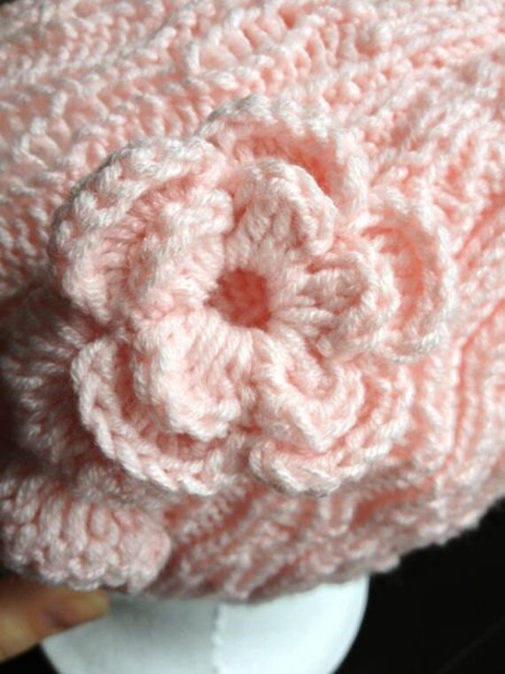 Knit hat with flower embellishment