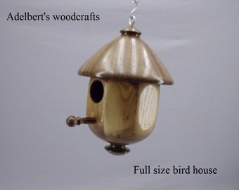 This lathe turned bird house is made of Black Walnut & Butternut.