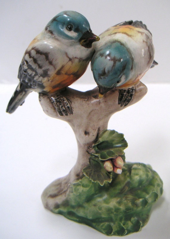 green bird figurine