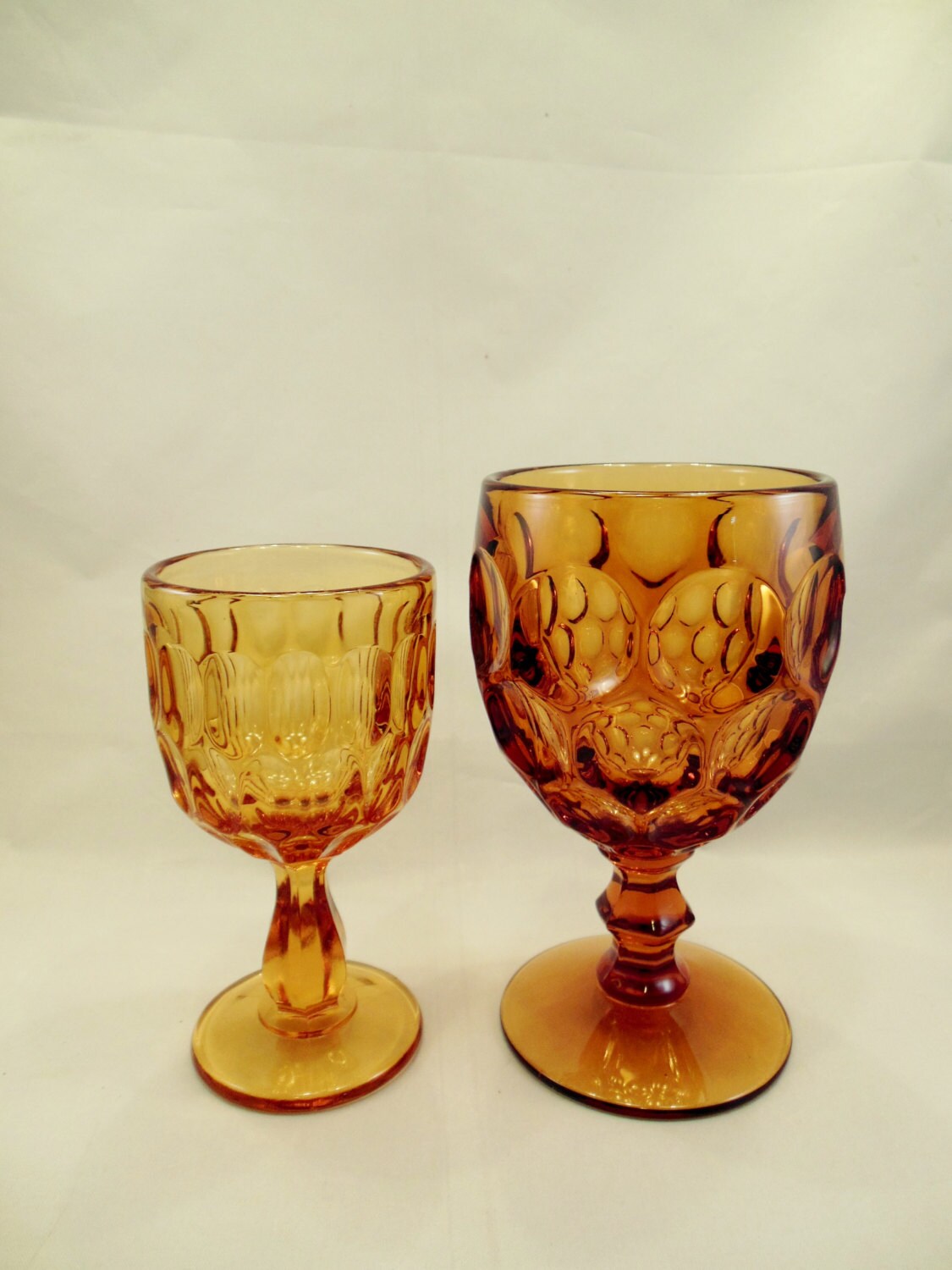 Pair of Amber Stemmed Glasses Mismatched Two Sizes of Goblets