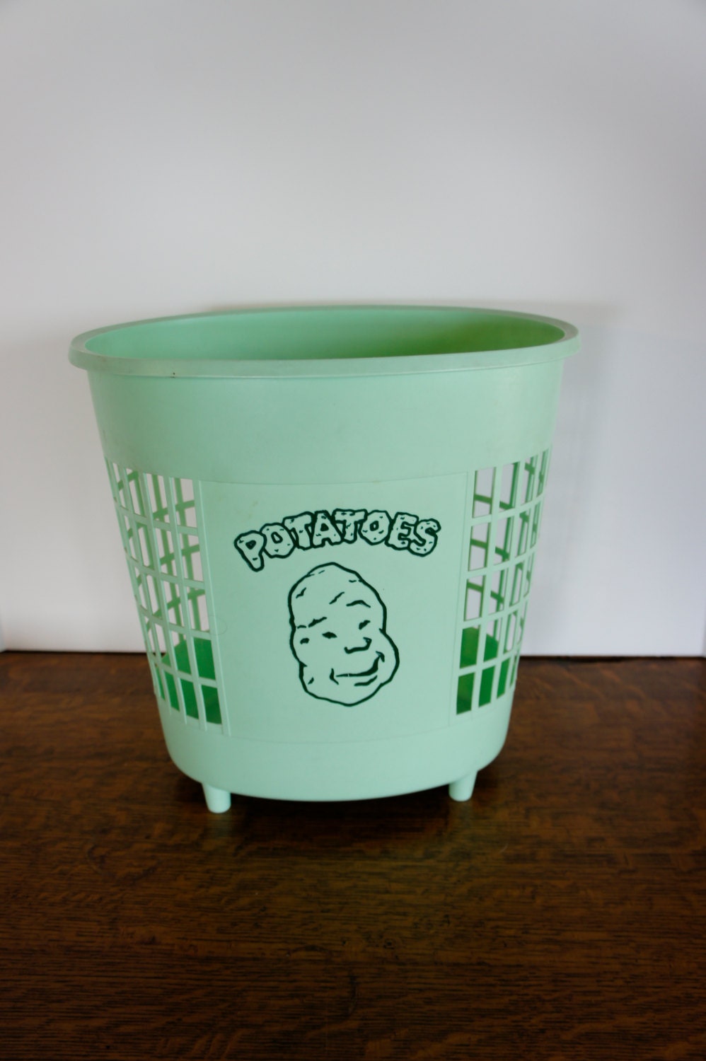 vintage mint green plastic weave potato bin or trash can