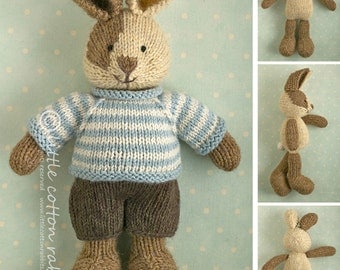 Toy knitting pattern for a bunny rabbit with a piebald patch, shorts and a stripy sweater