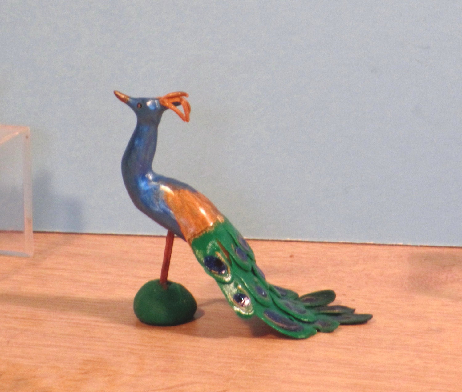 miniature peacock figurine
