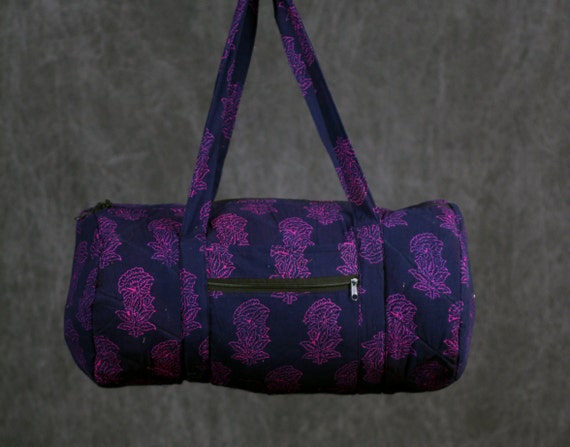 Quilted Duffle bag in Navy Blue with Fuchsia pink floral Print.