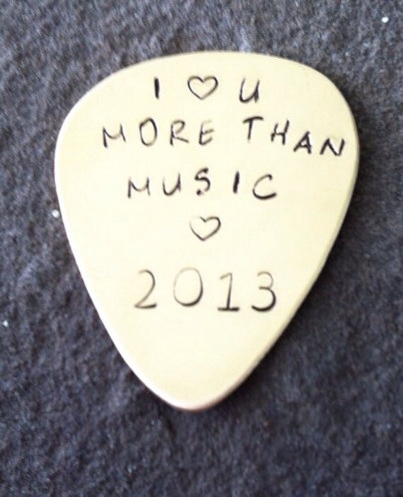 Hand stamped brass guitar pick customized by SunsetBlueGifts