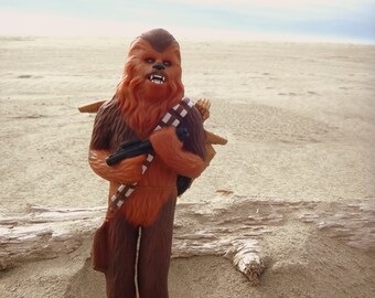 chewbacca carrying c3po toy