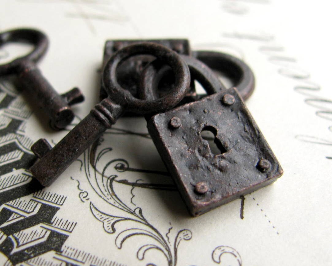 Rustic weathered jewelry box lock and key charm sets from Bad