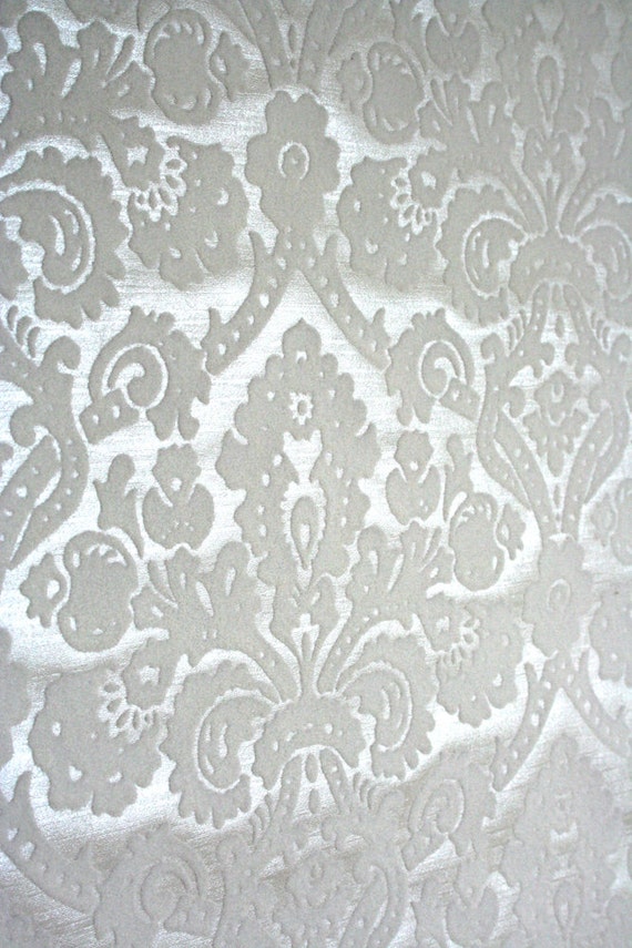 Elegant flocked mid century wallpaper. White on white.