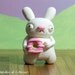 Cute Bunny Figurine with Pink Donut - Handmade Geekery - Weird Original Polymer Clay Sculpture - Offbeat Gift for Kids Teens and Adults