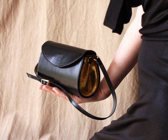 black handbag with gold detail