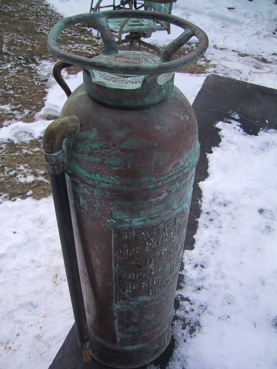 Antique Badger Fire Extinguisher with extensive patina