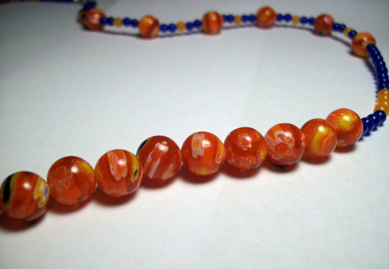 Long orange and blue beaded necklace by JinxyJewels on Etsy
