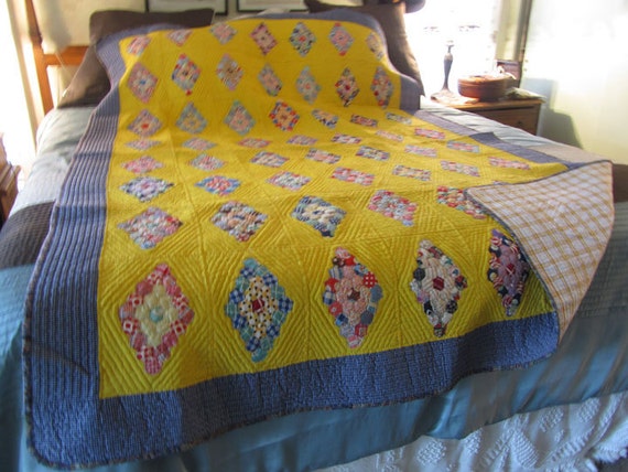 vintage quilt bright yellow navy blues and reds very small