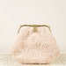 blush coloured clutch bag