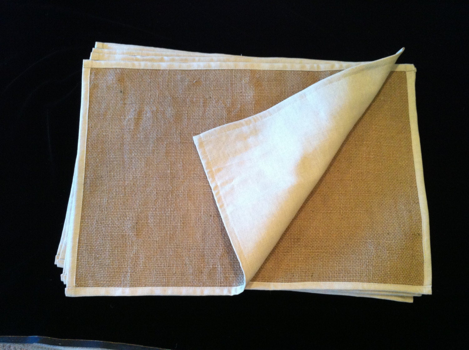 Six burlap placemats.