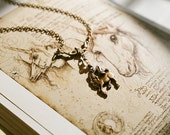 Magical unicorn lavalier necklace in antique brass