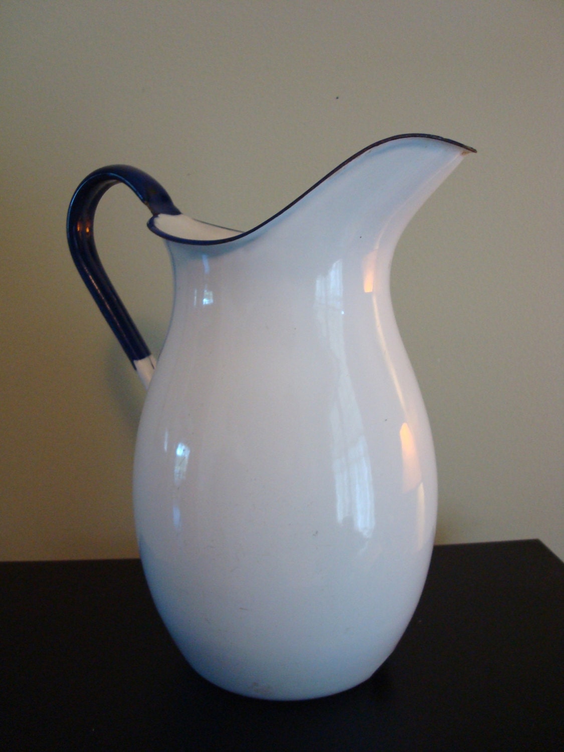 Large vintage white enamelware pitcher with cobalt blue trim