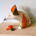 Retro mouse in a 60s vintage fabric of orange seed head barkcloth
