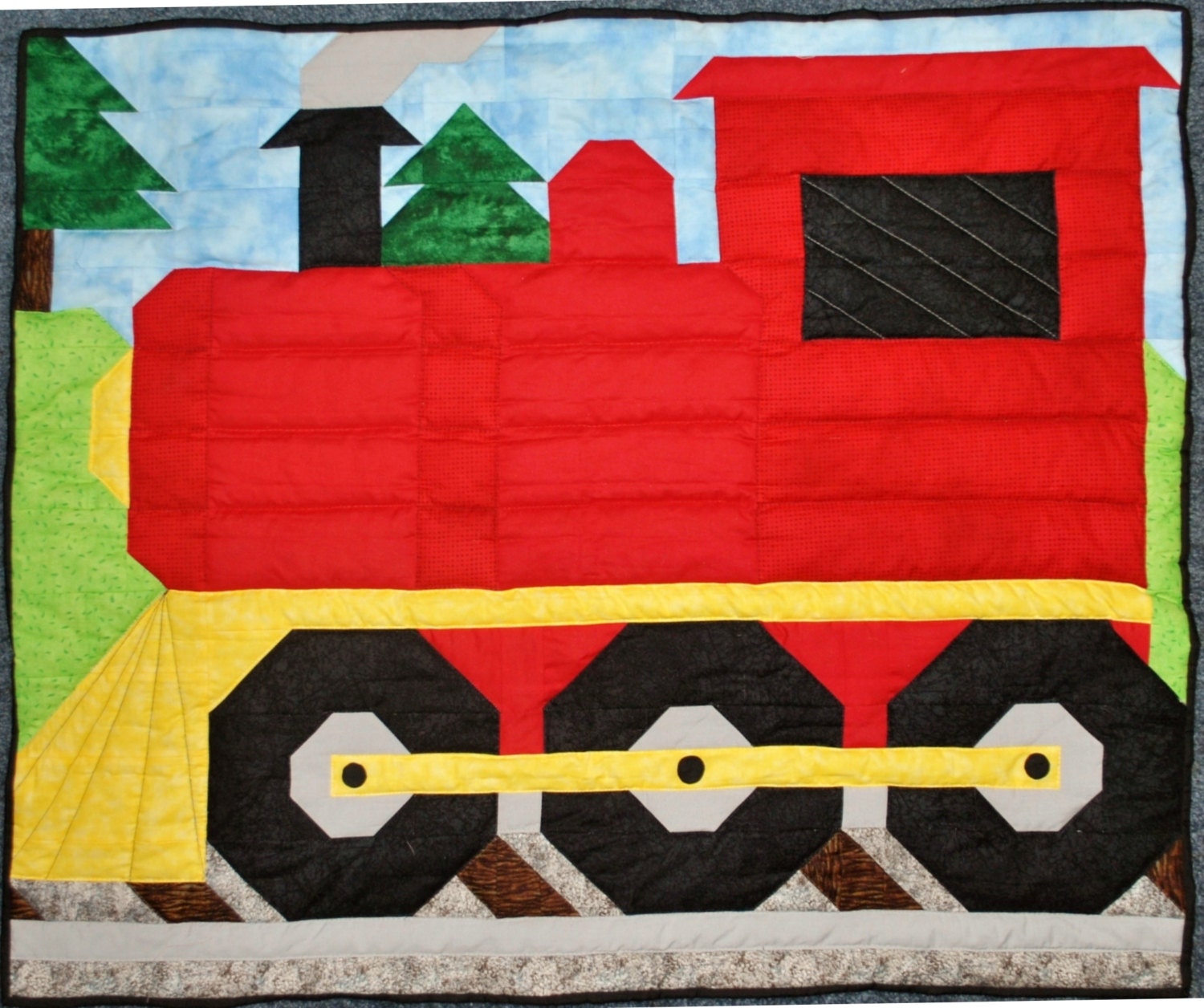 train-quilt-pattern-with-multiple-sizes-wall-by-countedquilts