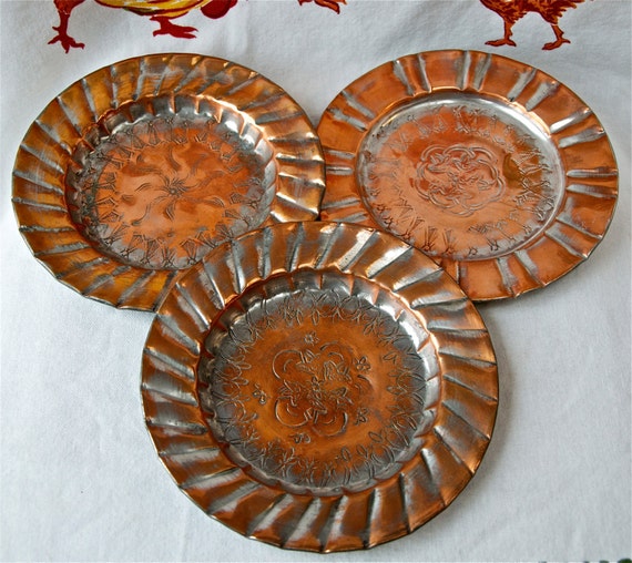 Three vintage etched or embossed copper plates...Middle