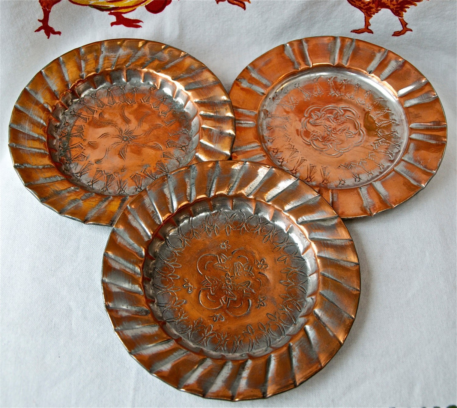 Three vintage etched or embossed copper plates...Middle