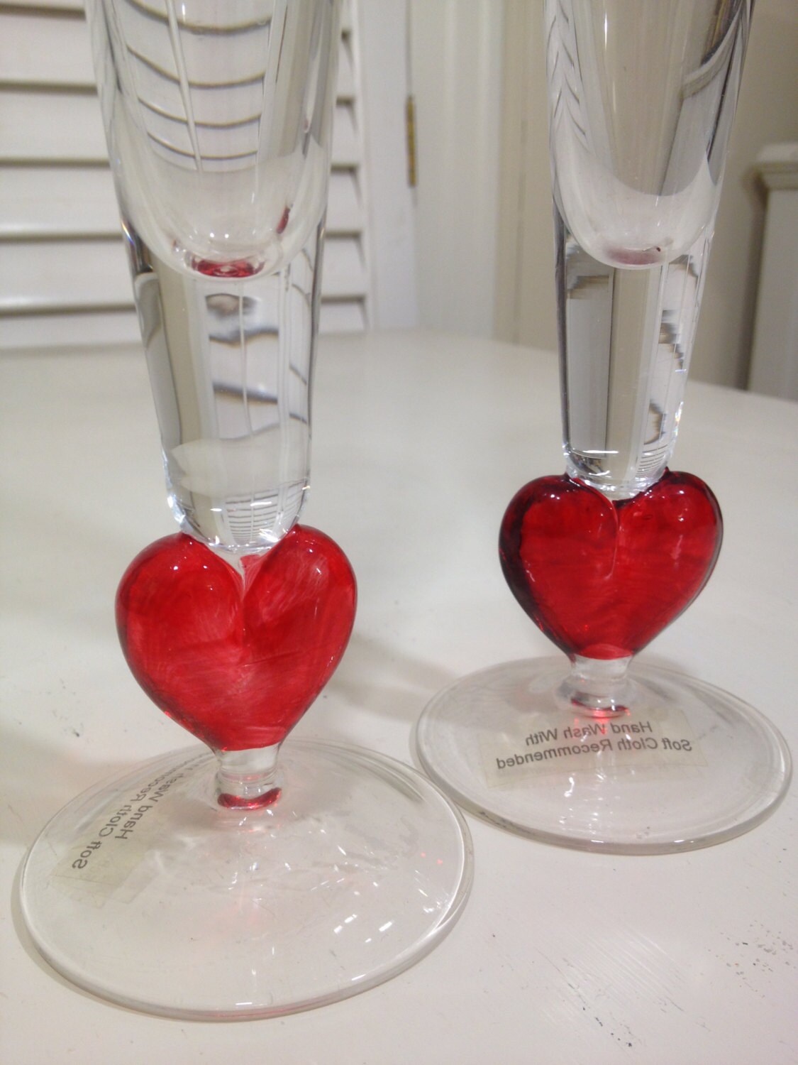 Champagne Flutes with Red Glass Hearts to toast your true love