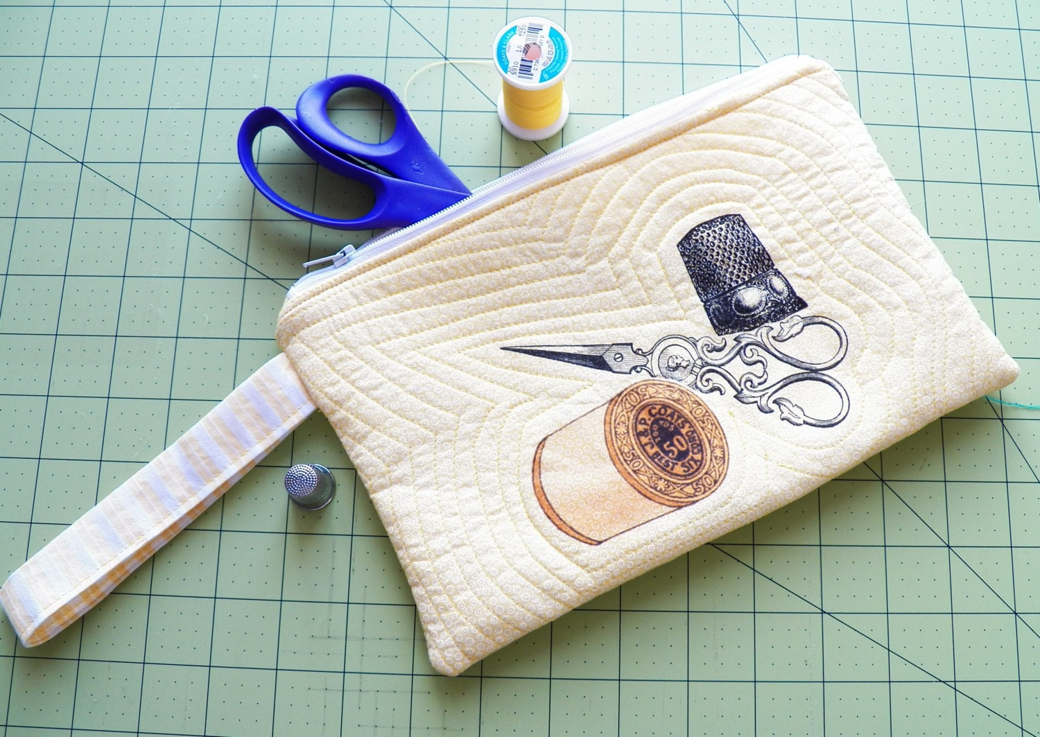 Zippered sewing accessory bag in yellow with vintage sewing