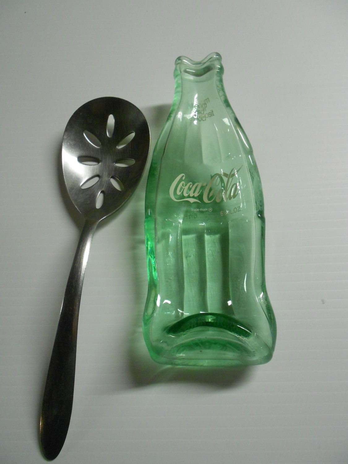 Coca Cola Bottle melted into a spoon rest