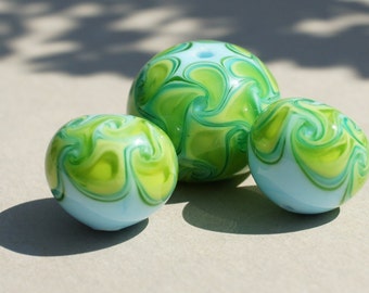 Handmade lampwork glass beadset in blue and green by Flamejewels.