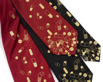 Pill tie, men's necktie. "Pill Spill." Gold capsule & tablet print. Choose standard-wide, narrow or skinny size. Silkscreened microfiber.