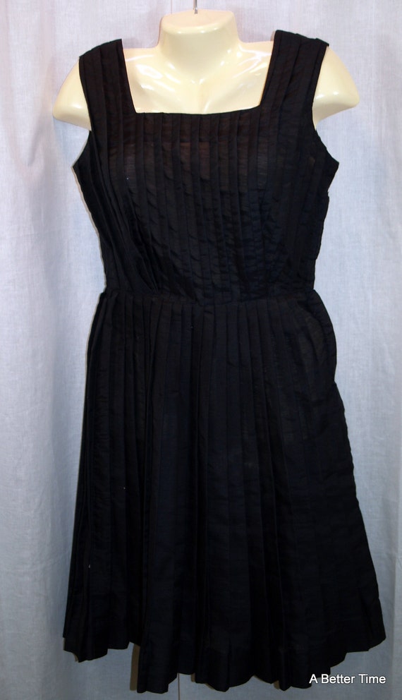Vintage 1950s black dress pleated side zipper