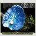 A Parrish blue Philodendron leaf cast into a birdbath/feeder on a pole (Leaf no. 1412)