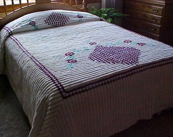 REDUCED. Heavy Vintage chenille bedspread with wine/purple diamond center and on pillow area-white background