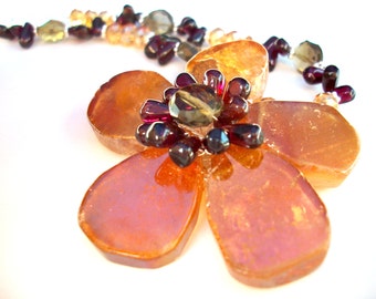Gemstone flower necklace wire wrapped with gold AB quartz, garnet, and smoky quartz on silver chain