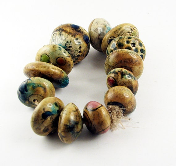 A molecular soup -- a special set of 13 ancient-looking ceramic beads with round dots