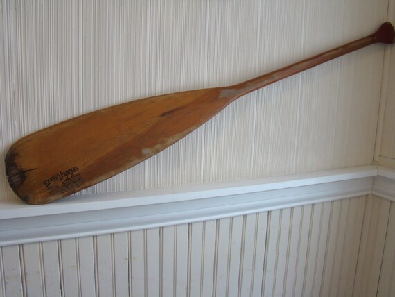 Vintage Beaver Brand canoe paddle for display