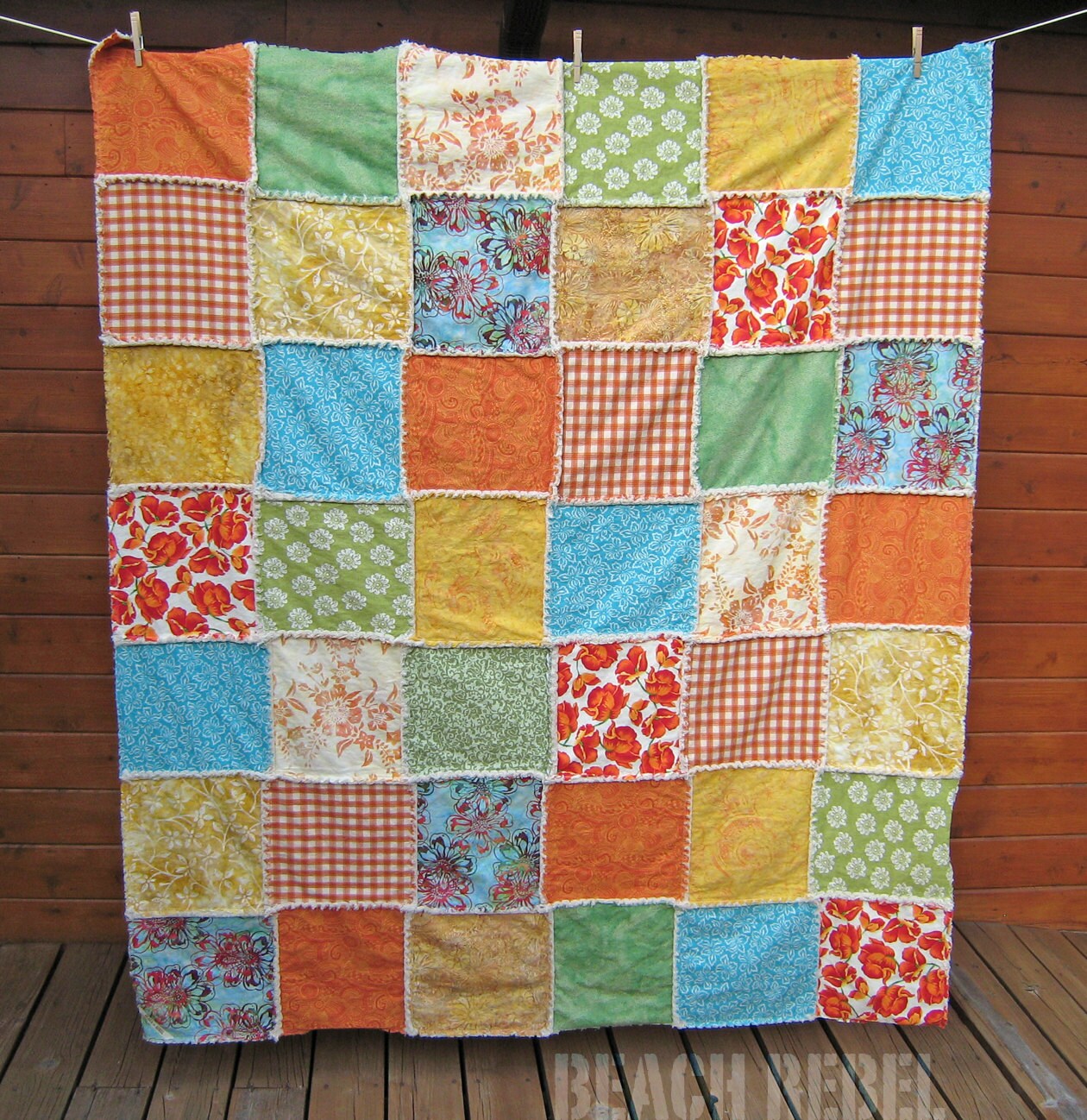 Natural denim rag quilt throw with batiks and prints in summer