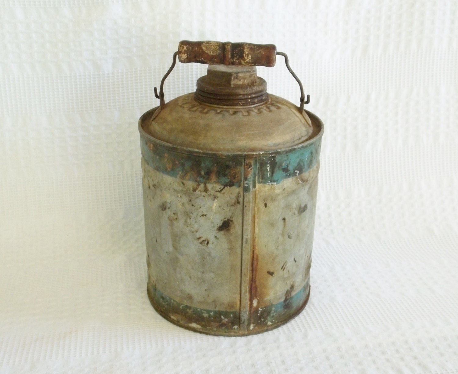 Vintage gas oil kerosene can with teal band stripe.