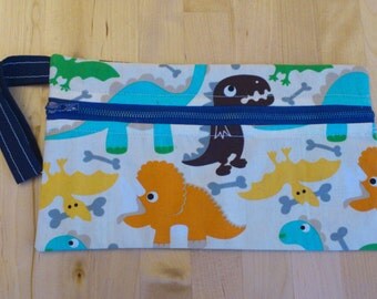 Dinosaurs zip wristlet