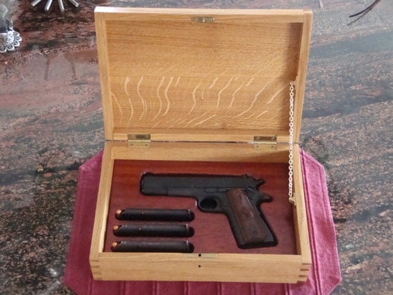 Custom-made wooden box for handgun display and storage