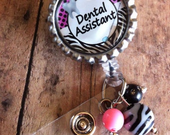 Dental assistant or dental hygienist badge reel retractable