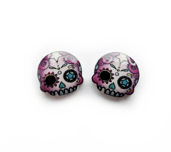 https://www.etsy.com/uk/listing/129527429/pink-day-of-the-dead-mini-skull-studs?ref=shop_home_active_21