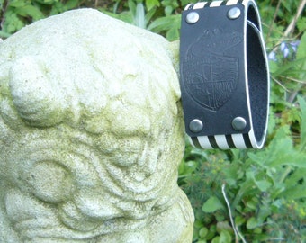 Lost Girls Pirate Academy Logo Embossed Leather Wrist Strap