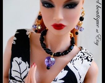 Purple Heart-shaped Crystal Necklace links with Black Glass Beads. Completes with Matching Earrings.