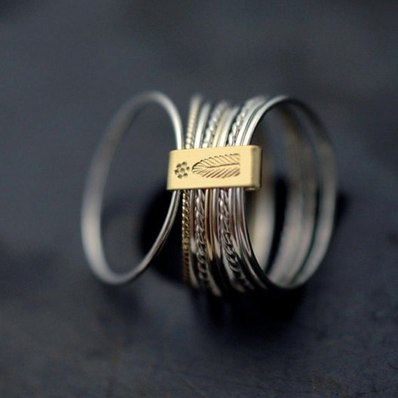 twist and turn silver with 14kt yellow gold stacking rings