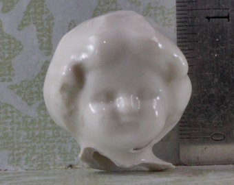 Frozen charlotte head damaged for altered art, doll or jewelry making
